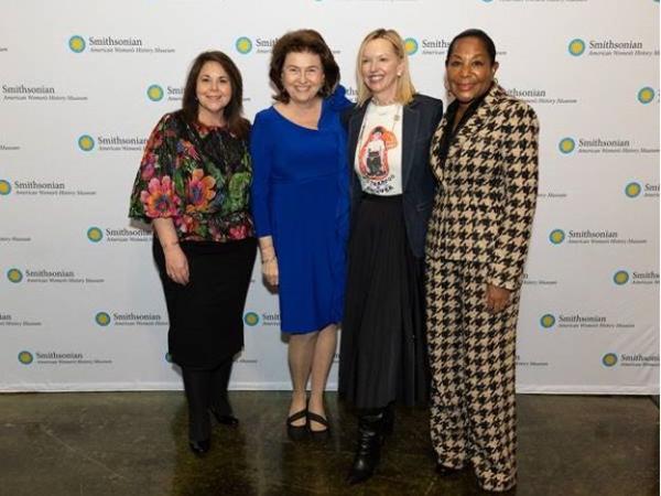 4 women standing together for a photo