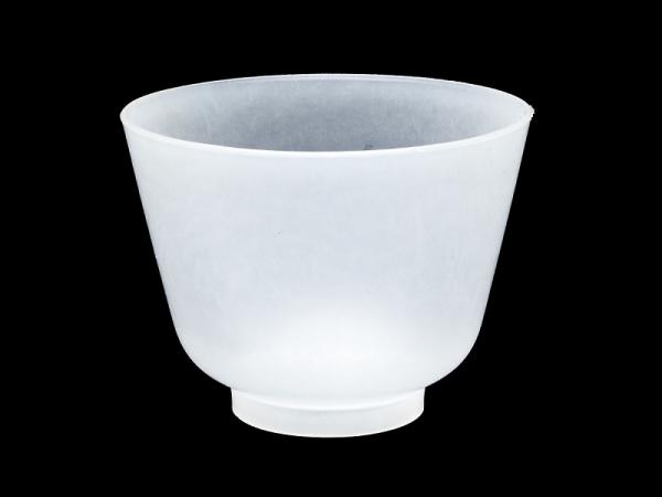 White plastic tupperware bowl against a black background