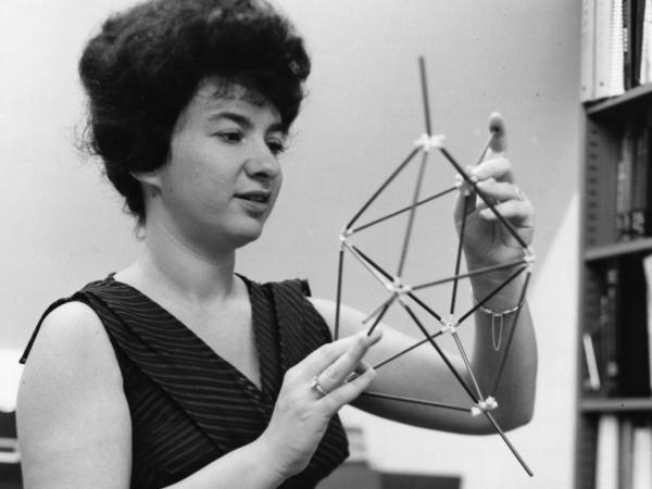 Woman chemist holding a molecular model