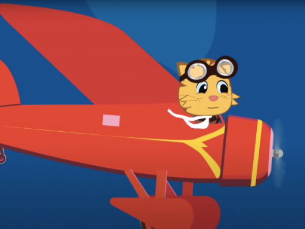 Cartoon cat wearing aviator goggles and a scarf flies a red plane.