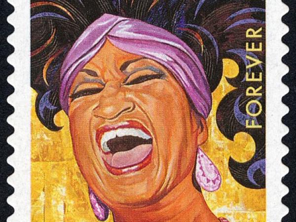 Colorful stamp featuring Celia Cruz singing.