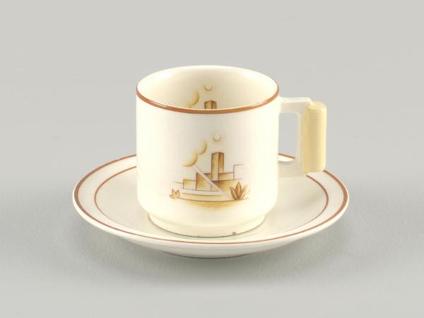 A white cup and saucer depicting an abstract outdoor scene. Image is on both inside and outside of cup. The saucer has brown stripes around the rim.