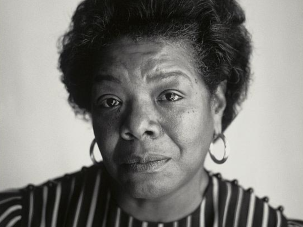 Black and white photograph of Maya Angelou wearing hoop earrings and a striped shirt