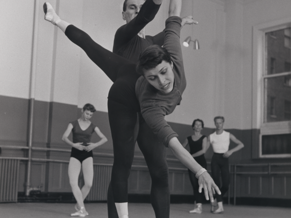 Black and white photo of Maria Tallchief doing ballet with a partner in a dance studio