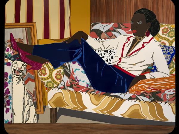 Portrait of a woman reclining on a colorful sofa.