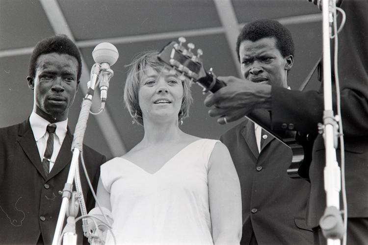 Photograph of Barbara Dane performing with the Chambers Brothers