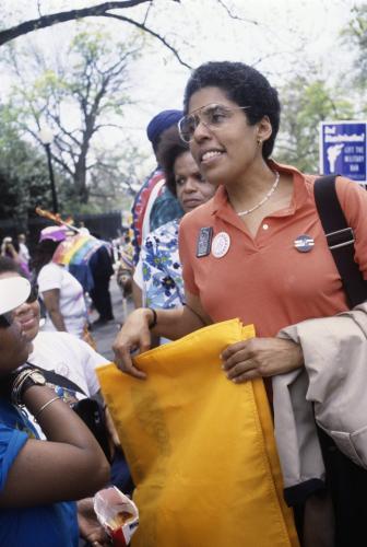 A portrait of Barbara Smith with a group of people.  