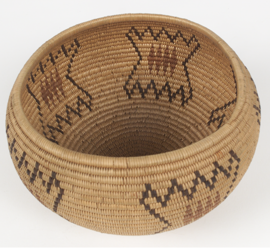 Round woven basket with geometric designs on the interior and exterior