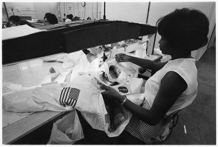 Hazel Fellows, an African American woman, sews a spacesuit