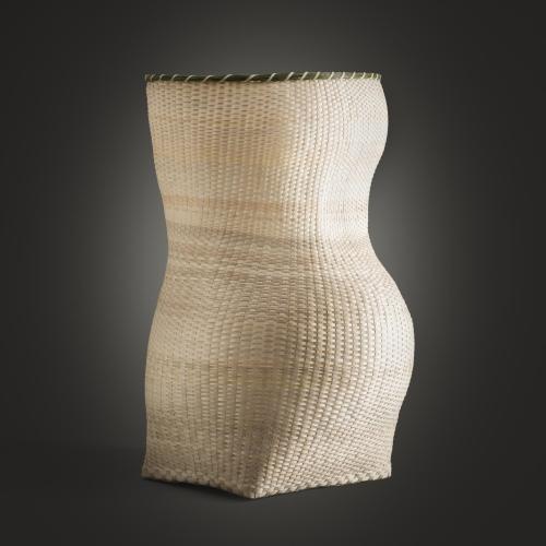 A woven basket in the shape of a female torso.