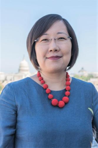 Lisa Sasaki stands in front of the U.S. capitol